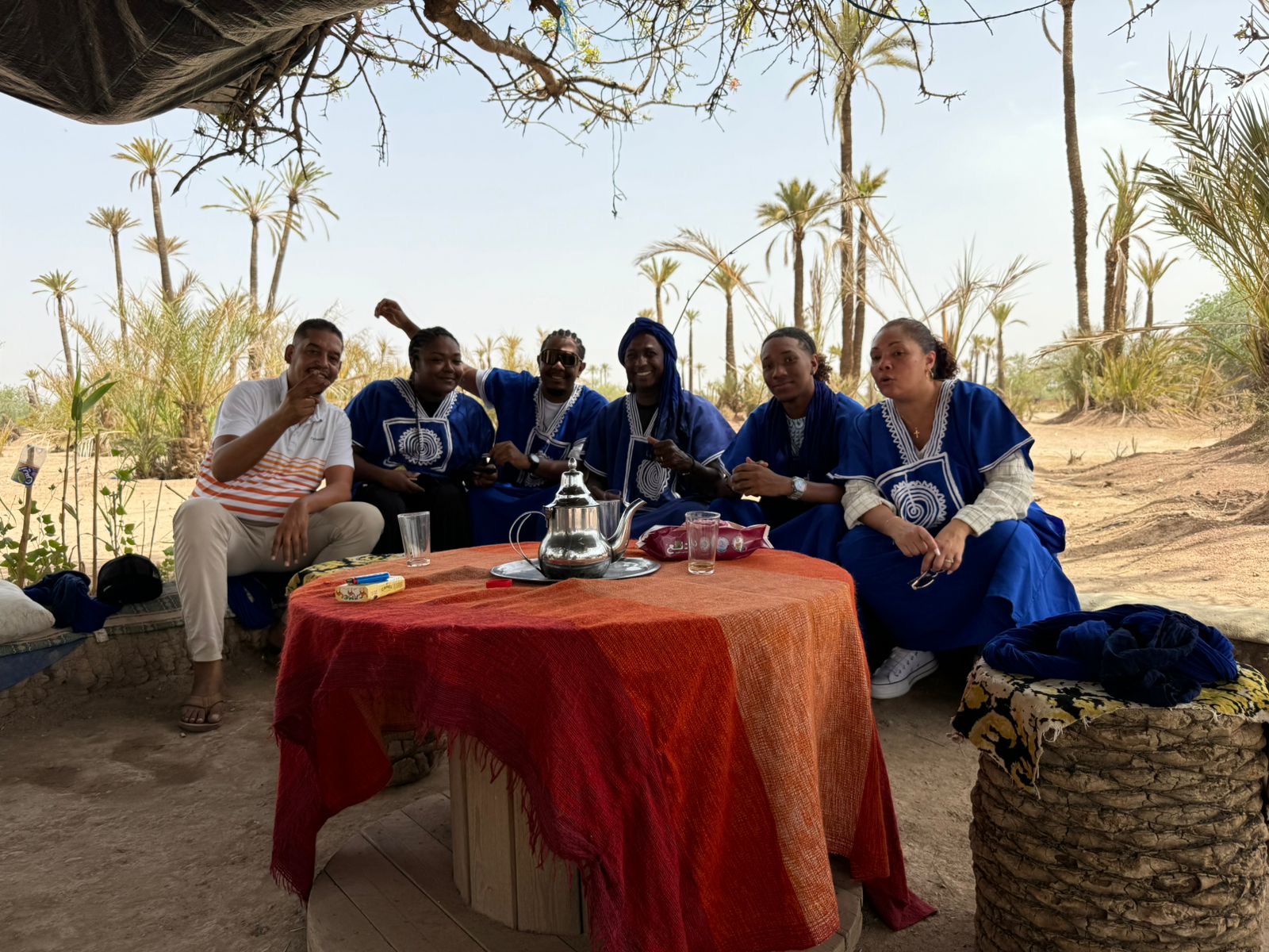 Guests taking mint tea in the Palmeraie on a private-driver day