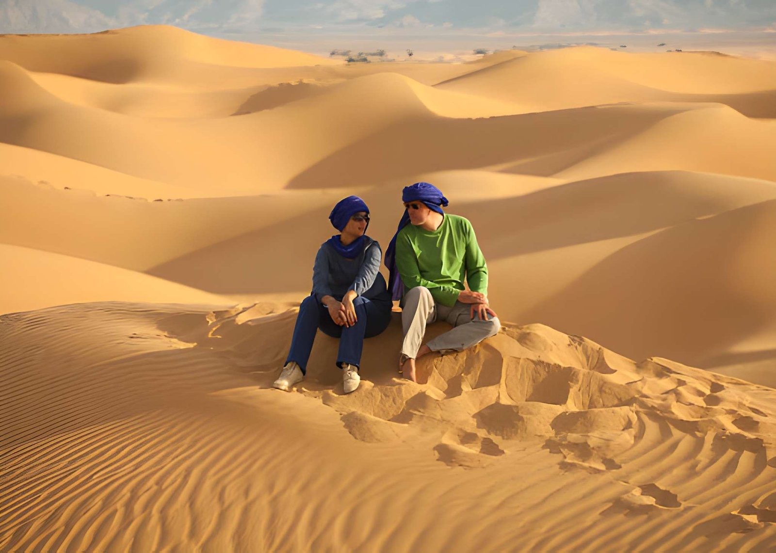 A couple on the Merzouga dunes, in blue turbans